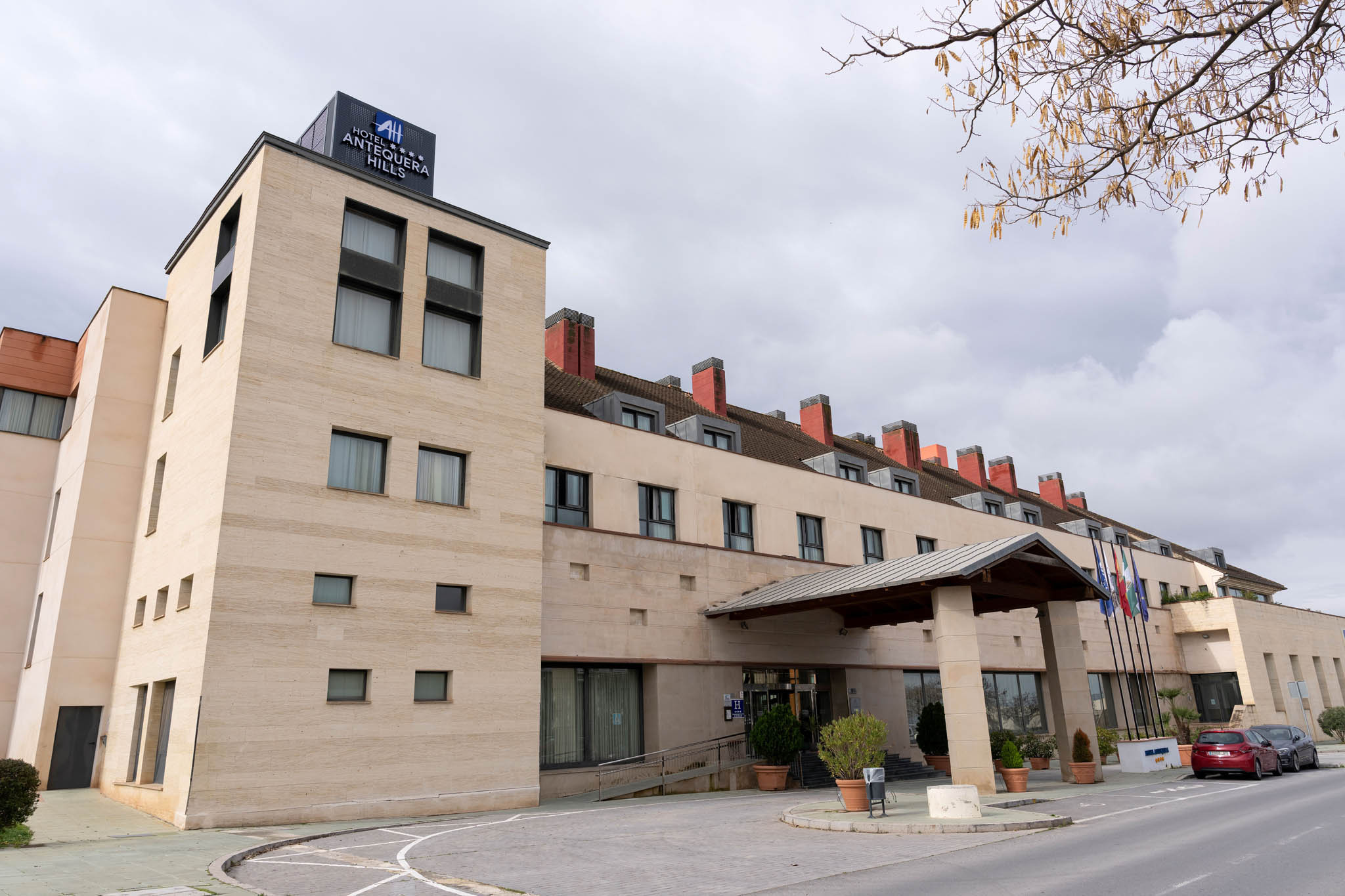 Modern hotel building with entrance canopy.