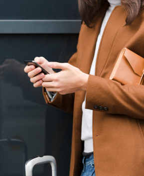 Woman walking with shopping bags.
