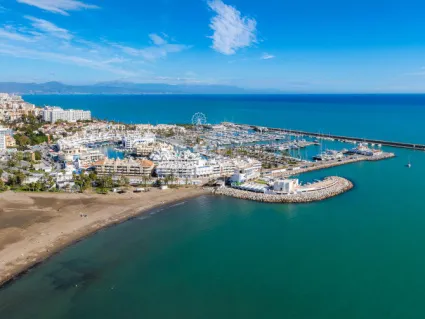 Aerial view of the Benalmadena marina and the Ferris wheel in Spain
